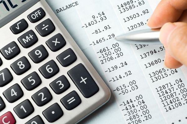 accounting professional using calculator