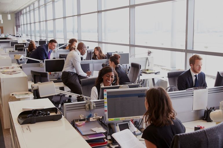 office workspace filled with employees